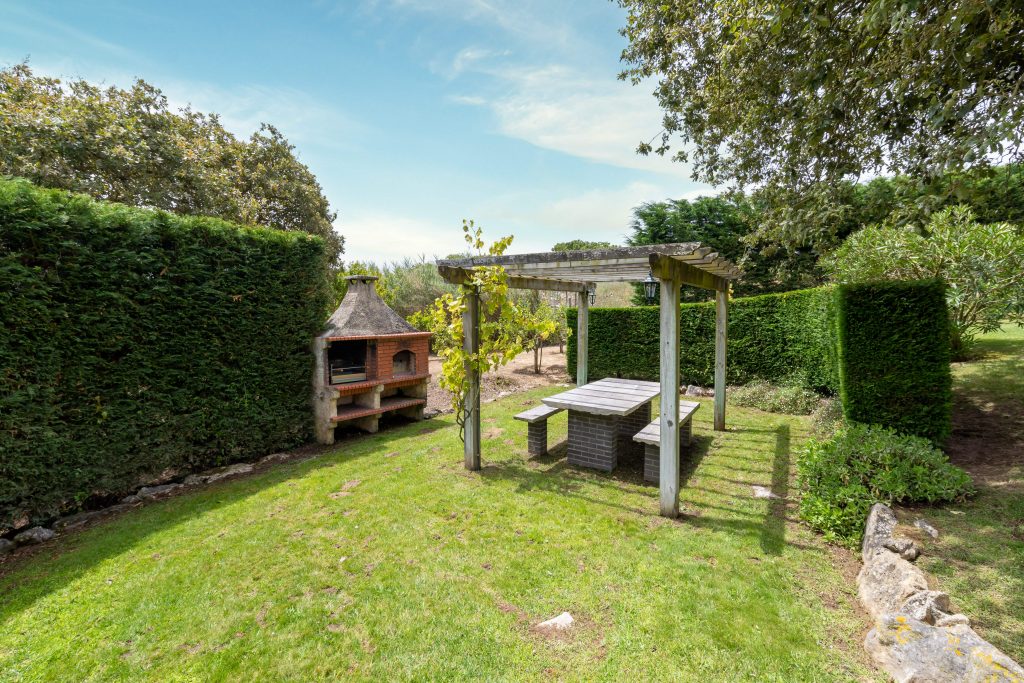 Our BBQ area down the garden; enjoying the evening sun below the pergola