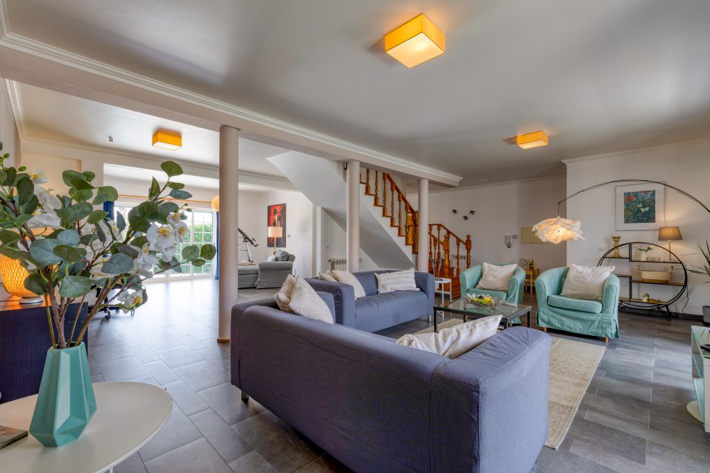 The main living room. Do you spot one of the chaisse longues in the back?