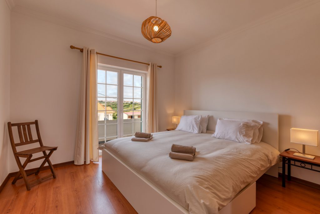 King size bed with access to the balcony
